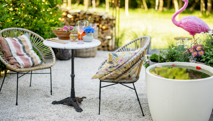 A cozy outdoor lounge with table and chair